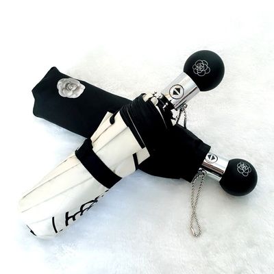 Rimanete protetti in stile Camellia protezione UV ombrello a tre pieghe per le donne coreane