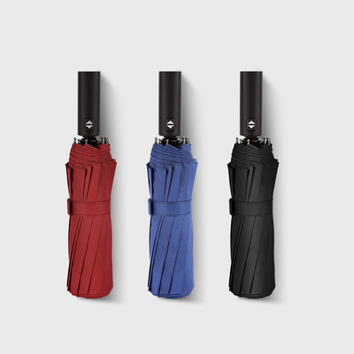 Manico rivestito di gomma 12k 23inch Windproof Triple Pliding Umbrella con logo personalizzato